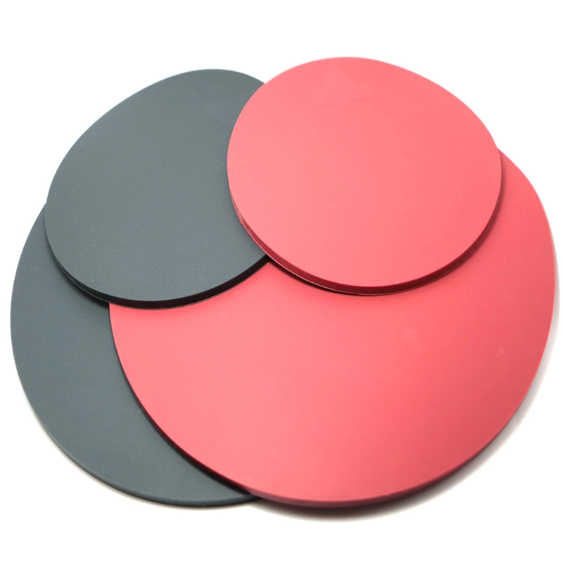 Solid flat round silicone discs in red and dark gray, smooth non-slip silicone sheets for equipment sealing and surface protection