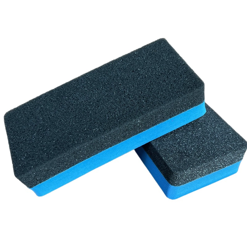 Block sponge eraser with black porous surface and blue underlayer