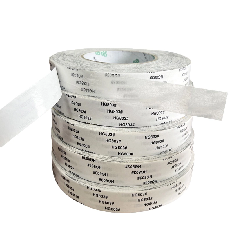 White HG803 double‑sided tape roll with partial release liner peeled open for display